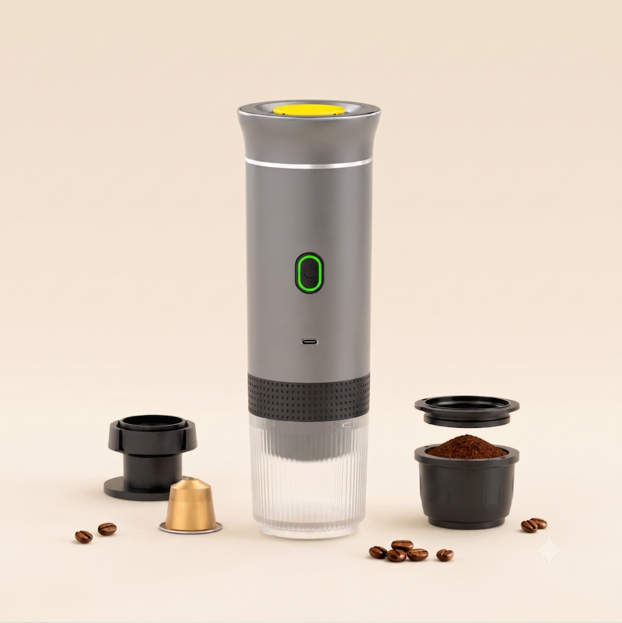 A modern electric manual coffee grinder with a gray body, clear lower chamber, and yellow top button, shown with its interchangeable parts and coffee beans on a warm beige background.